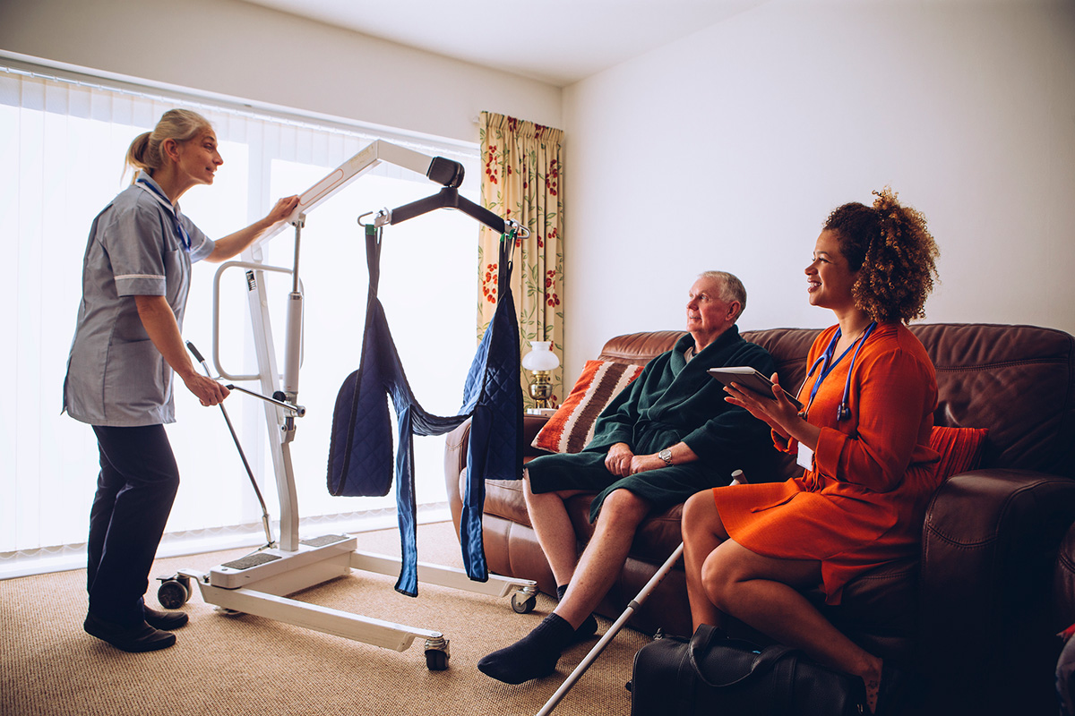 Physical Disabilities Homecare Workers Preparing Hoist